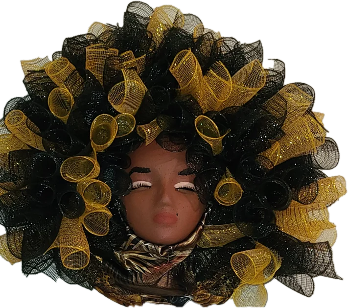 Portrait wreath with a face framed by curled black and gold mesh